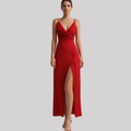 Woman wearing a floor-length maxi dress with spaghetti straps, draped bodice, and high side slit._0
