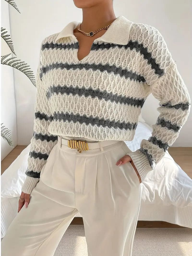 Woman wearing a striped textured knit sweater with collared neckline, styled with cream trousers and a gold belt._0