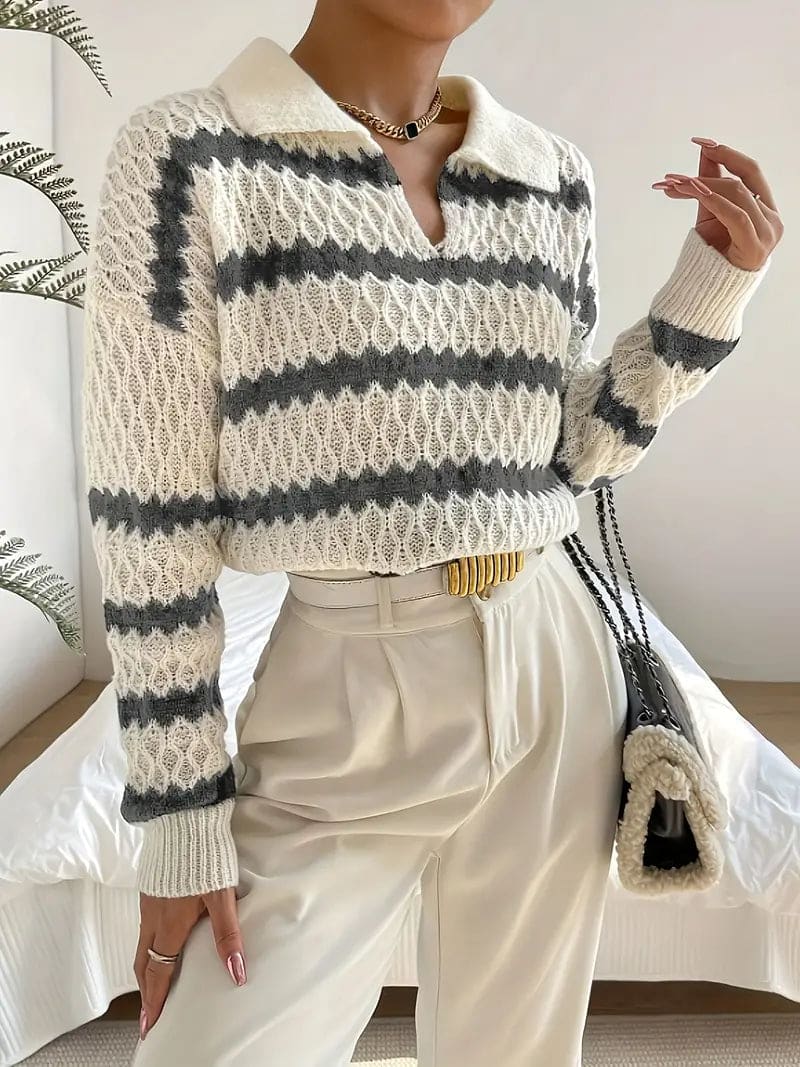 Woman wearing a striped textured knit sweater with collared neckline, styled with cream trousers and a gold belt._3