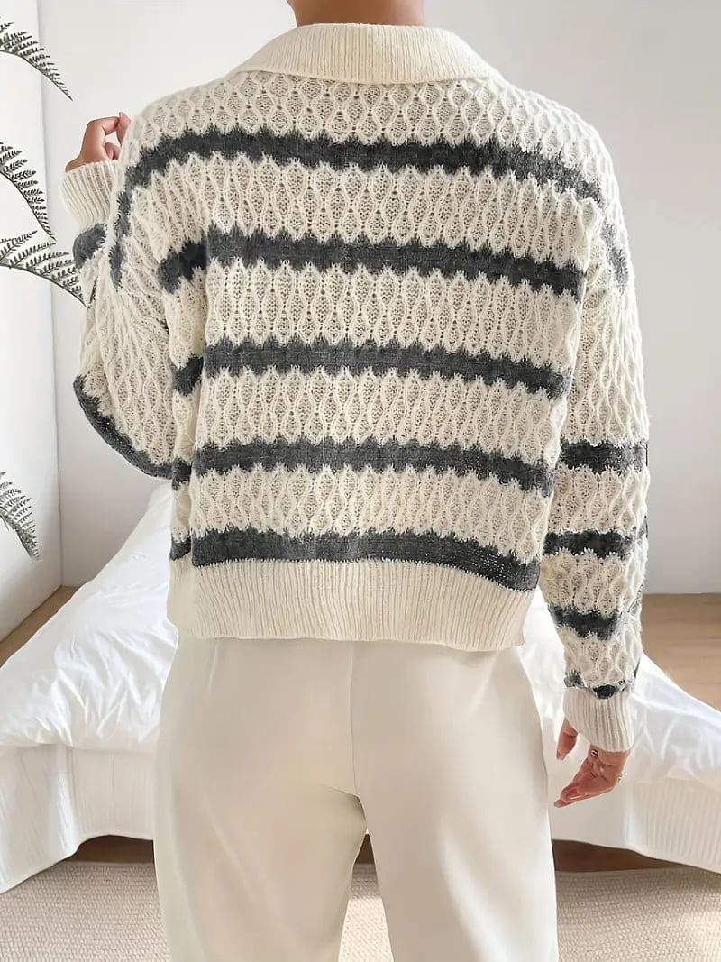 Woman wearing a striped textured knit sweater with collared neckline, styled with cream trousers and a gold belt._4