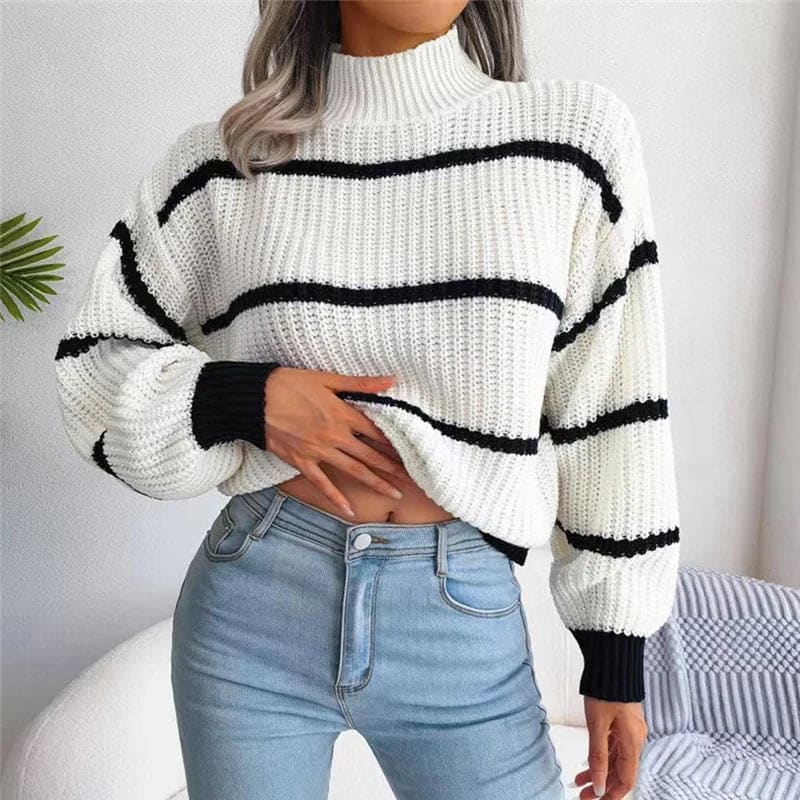 Woman wearing a relaxed fit striped turtleneck sweater with ribbed knit texture and full sleeves._0