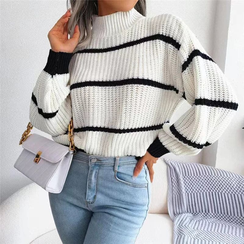 Woman wearing a relaxed fit striped turtleneck sweater with ribbed knit texture and full sleeves._2