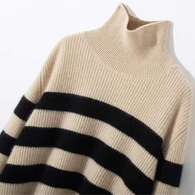 A model wears a striped turtleneck sweater with long sleeves and a relaxed silhouette._12