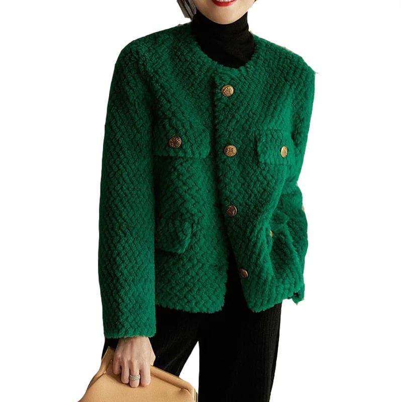 Woman wearing a textured short jacket with gold buttons in a tailored silhouette, viewed from behind._18