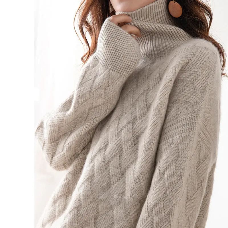 Woman wearing a beige oversized turtleneck sweater with cable knit texture and relaxed sleeves_3