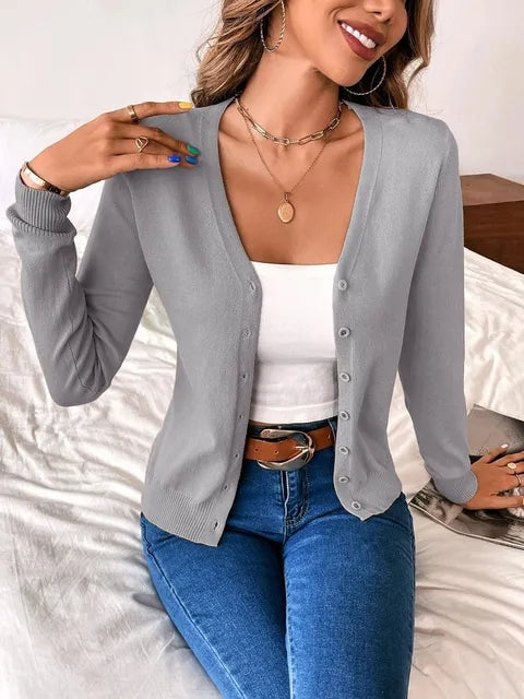 Gray long-sleeve cardigan featuring a V-neck and front buttons.
